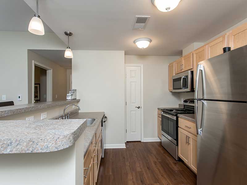 Kitchen of a one bedroom apartment at The Legends at Whitney Town Center