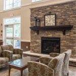 Community room fireplace at The Legends at Whitney Town Center